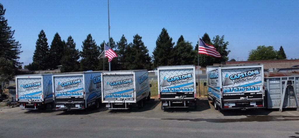 Capstone Roofing trucks parked