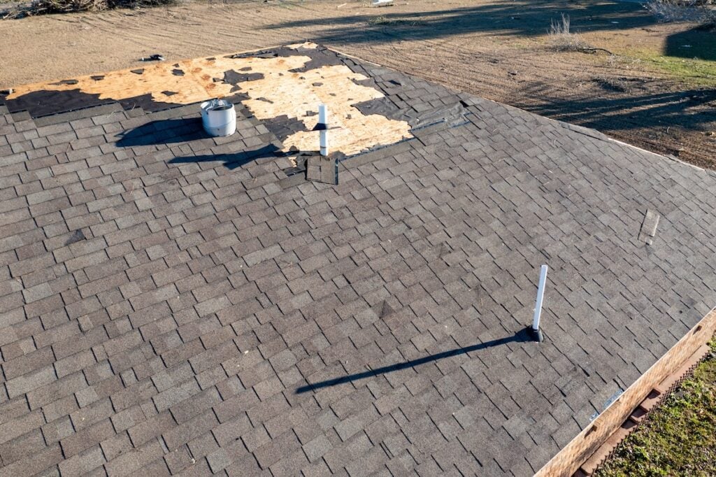 Tornado damage to roof and shingles.