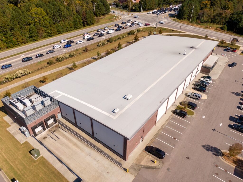 Sunny Daytime Drone Images of a Large Commercial Roof.