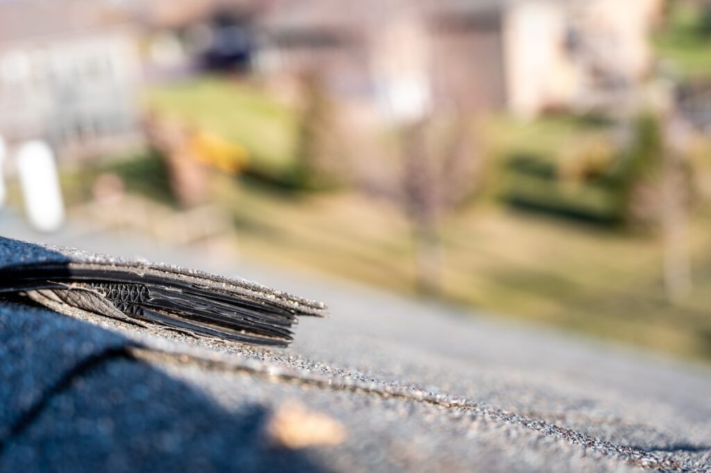 Typical residential ridge cap on a shingle roof apex
