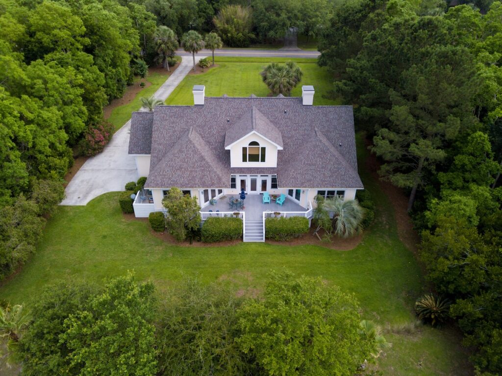 Aerial view of large home with new roof 