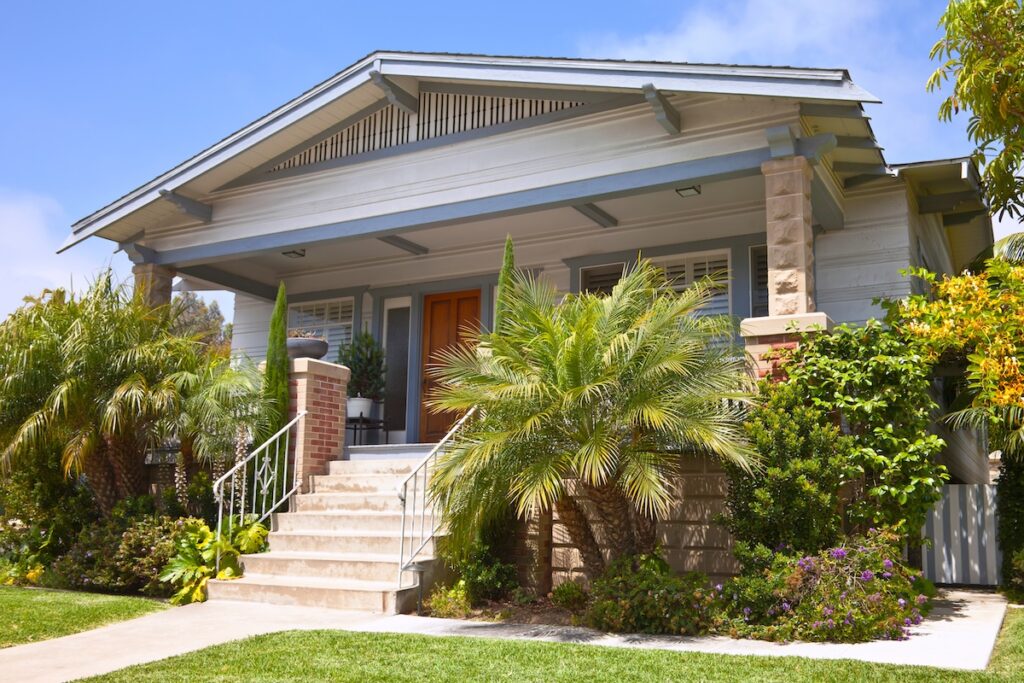 A traditional home with a green entrance and new roof