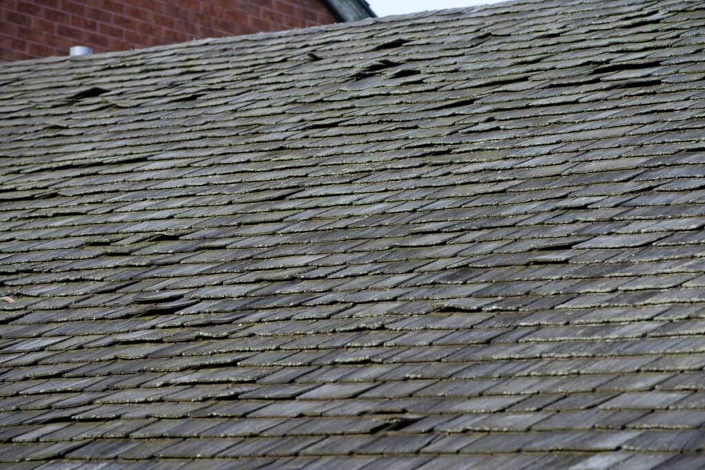 old roof with loose shingles