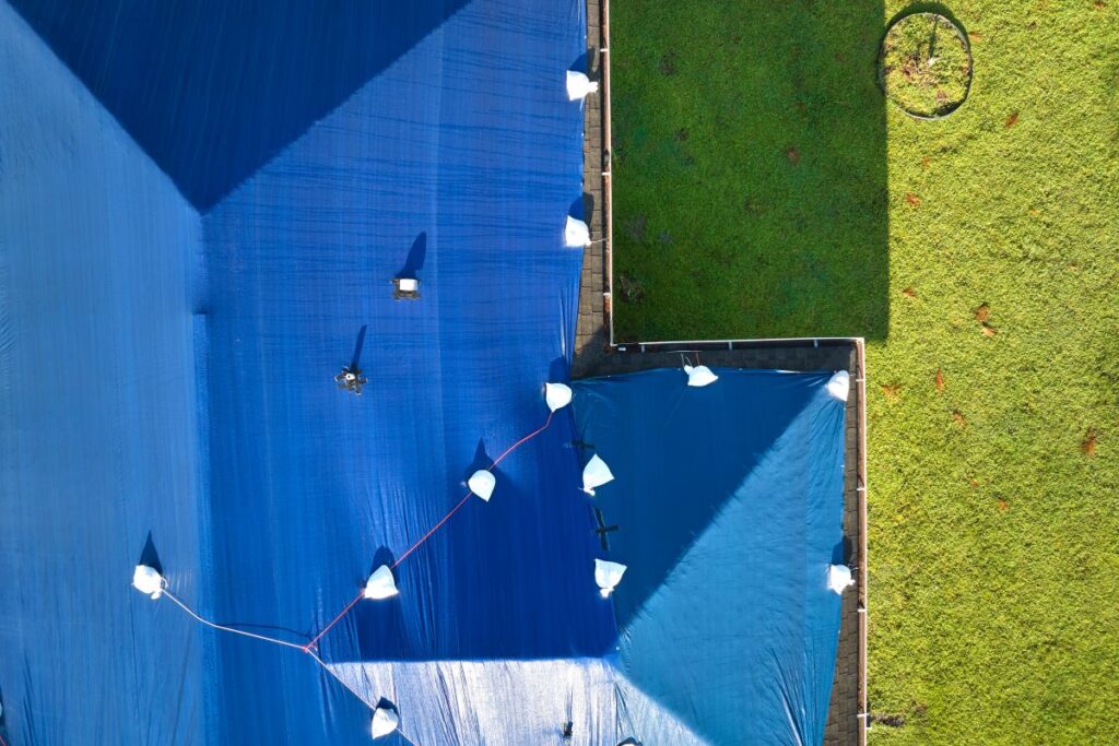 how to tarp a roof aerial view big house