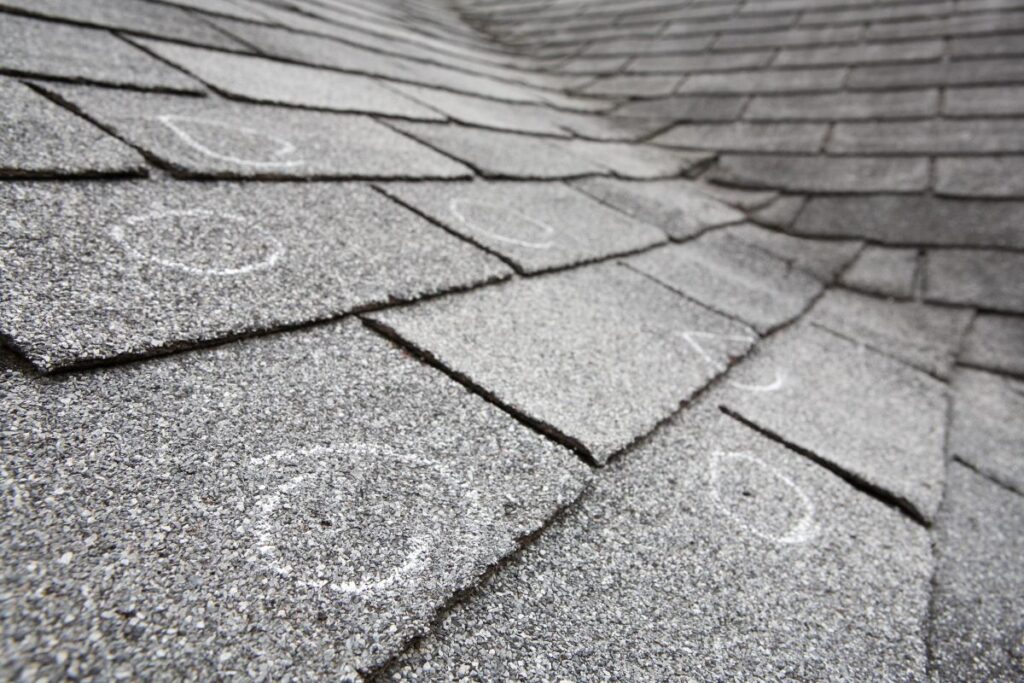what does hail damage look like on a roof shingles marked