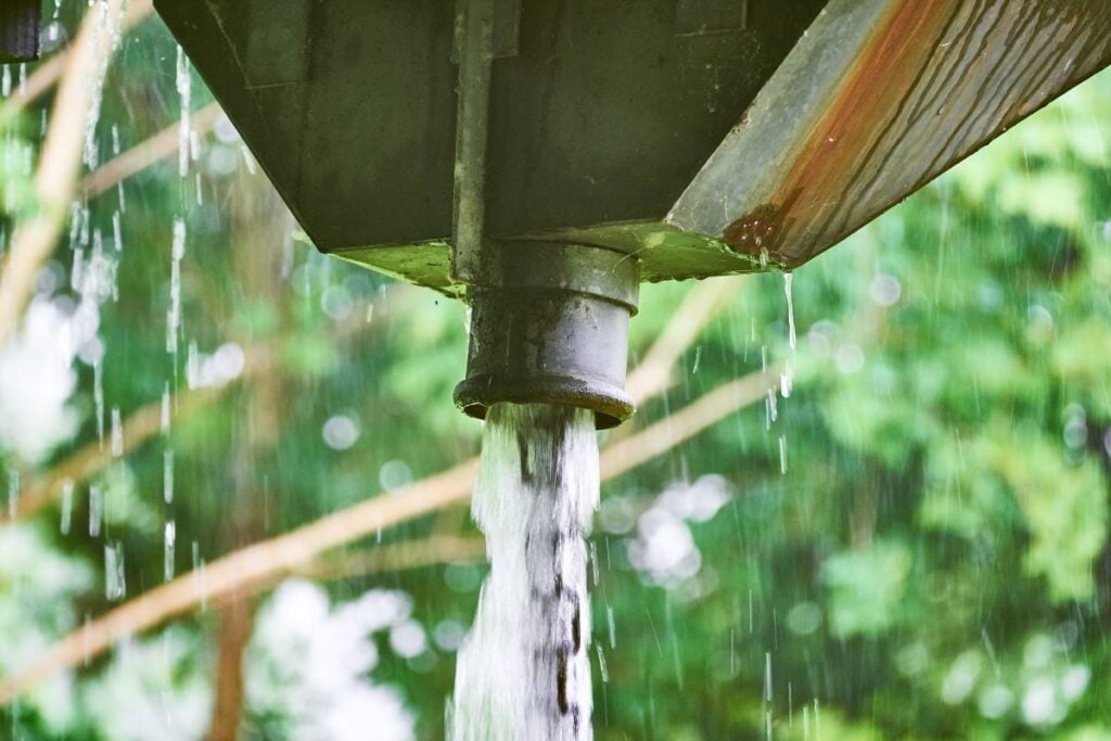 Large amount of water running from a scupper box