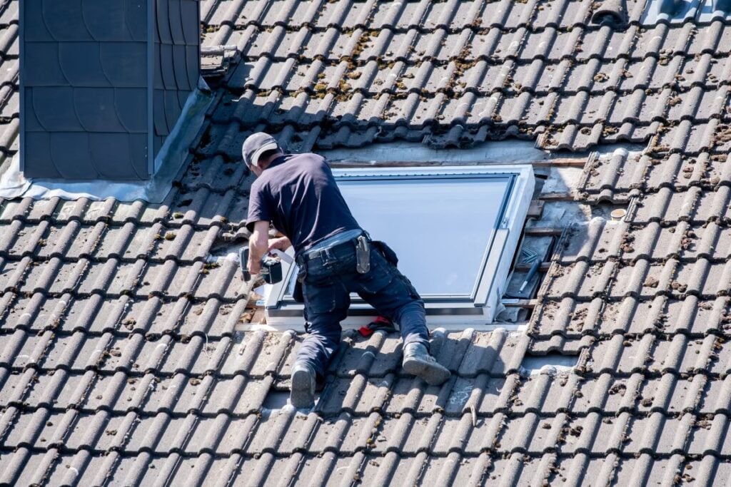 roofer installing a skylight